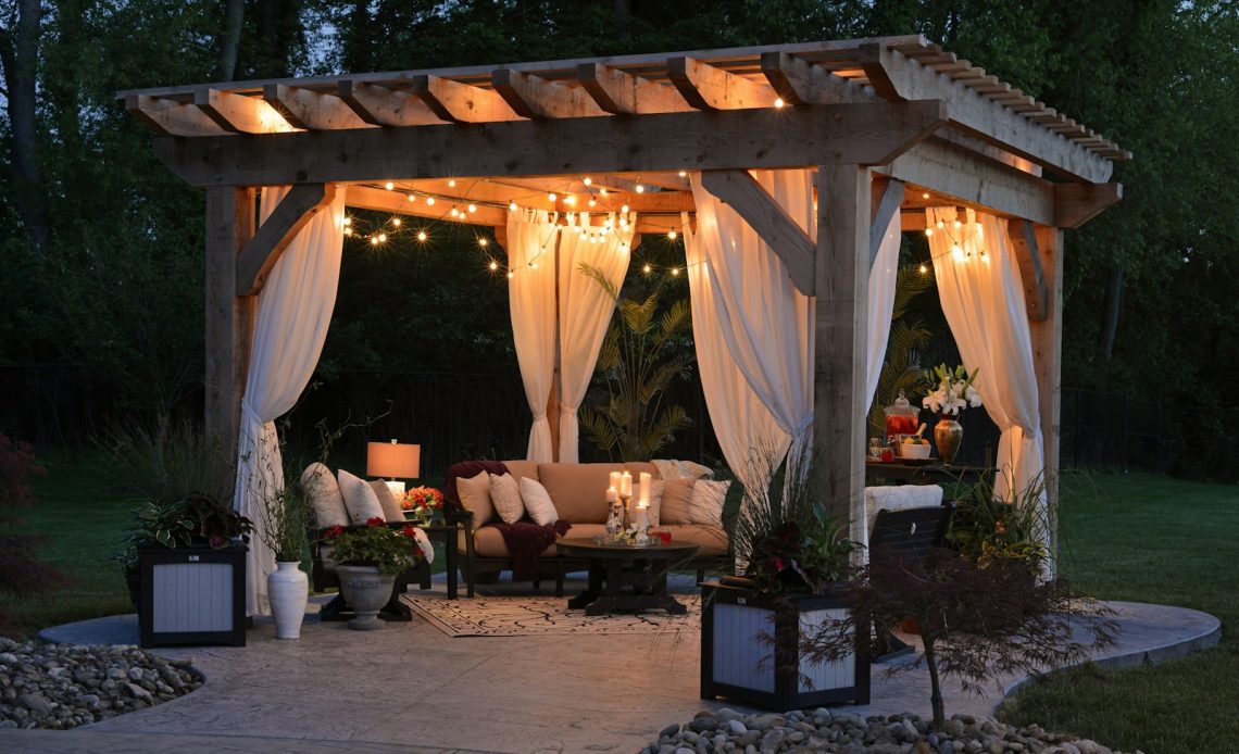 photo of gazebo with curtain and string lights