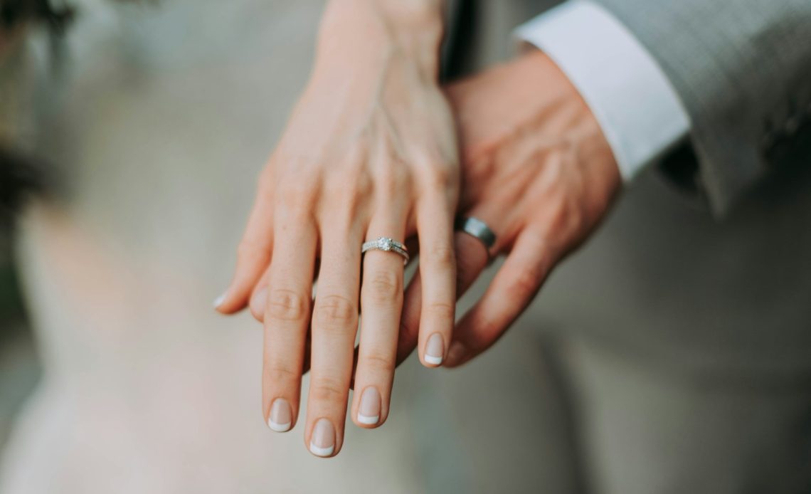 woman touch man's hand