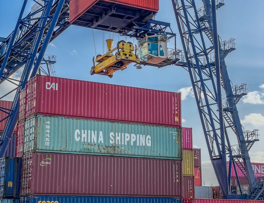 a crane is lifting a container onto a truck