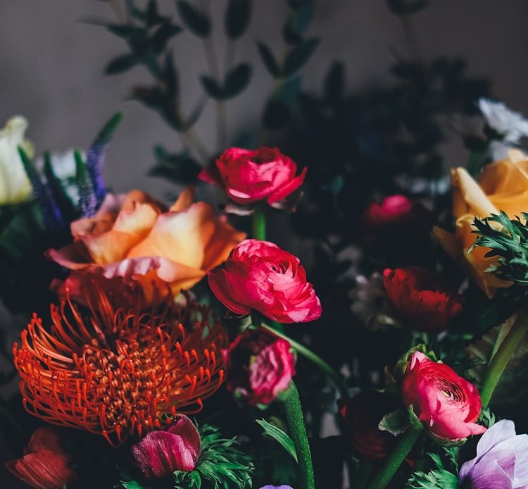 assorted petaled flowers centerpiece inside room