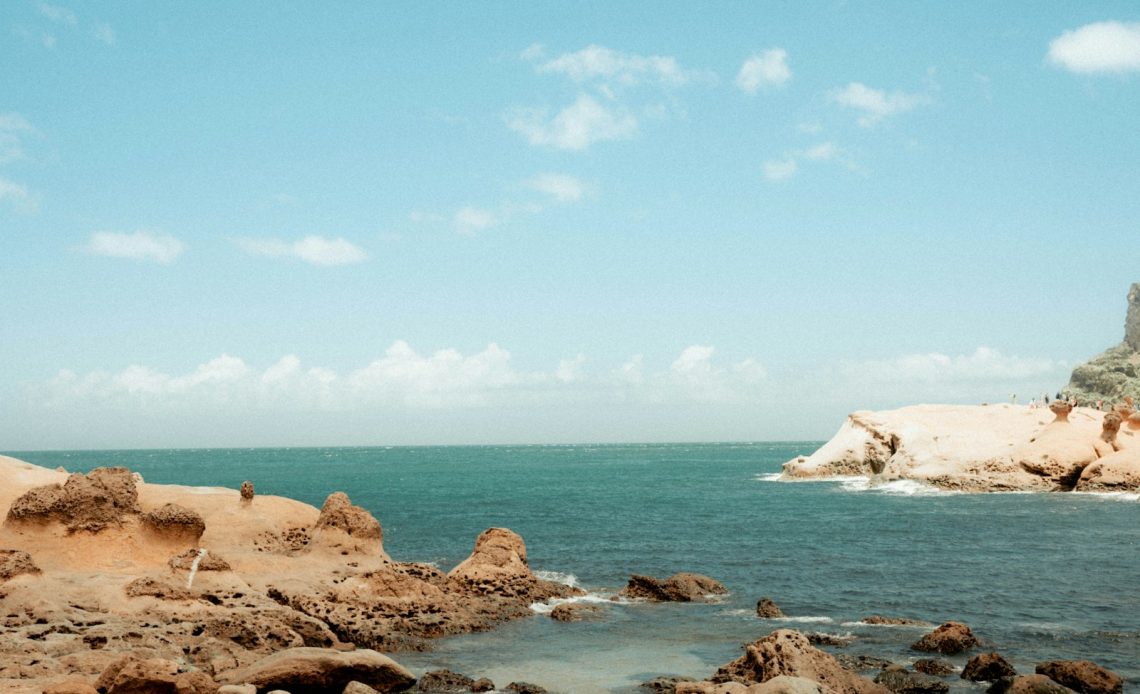 body of water and rock formation